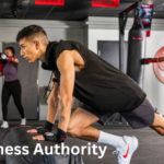 Members working out at Delta Fitness Authority gym with trainers and modern equipment